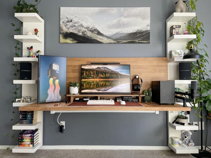 Wall-mounted floating desk setup maximizing floor space in small room with minimalist design and storage