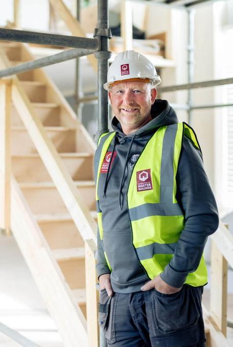 A trusted, professional builder smiling