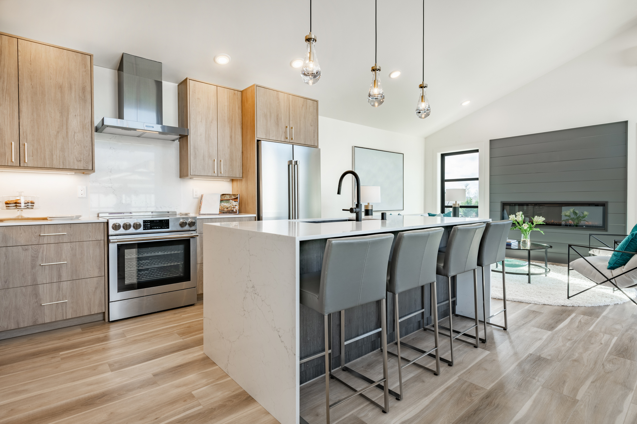 A modern, high-end kitchen with an island, a key cost driver in renovations