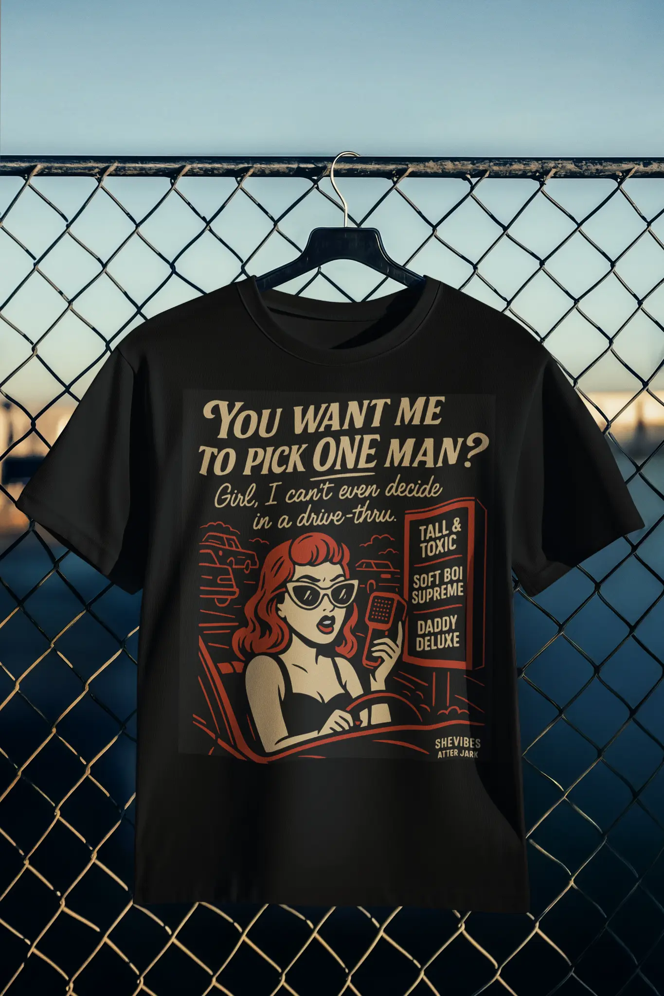Funny Drive-Thru Quote T-Shirt hanging on a fence